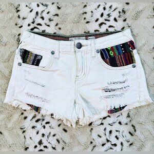 Free People Vintage White Distressed Denim Shorts With Accent Pattern Pockets